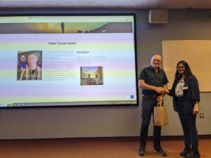 Swaetha Ramkumar is being awarded the Peter Curran award. Prof. Paul Callanan is presenting it to her.