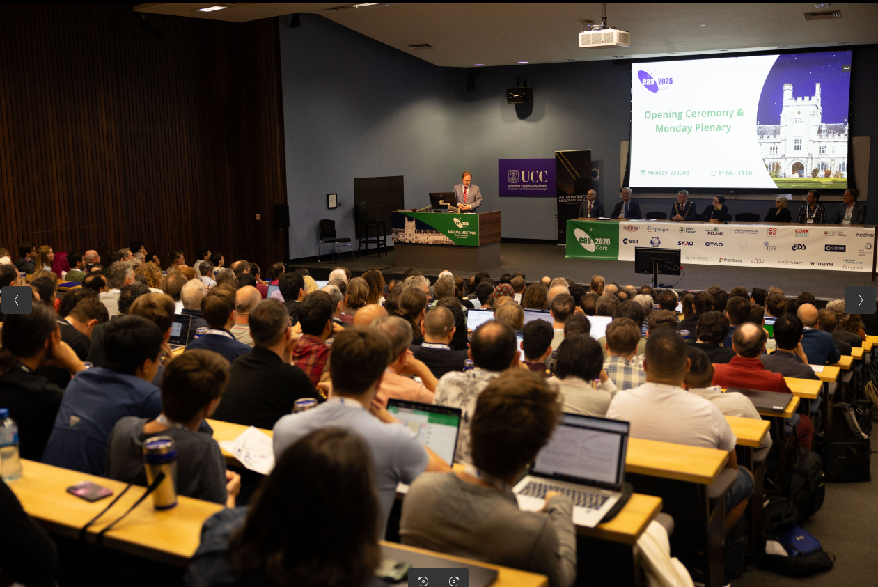 EAS2025 A crowded lecture hall, with the minster of Further and Higher Education, Research, Innovation and Science delivering the opening address.